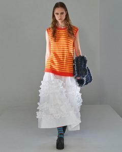 Orange and red striped sweatervest and white skirt during the Molly Goddard spring/summer 2022 runway