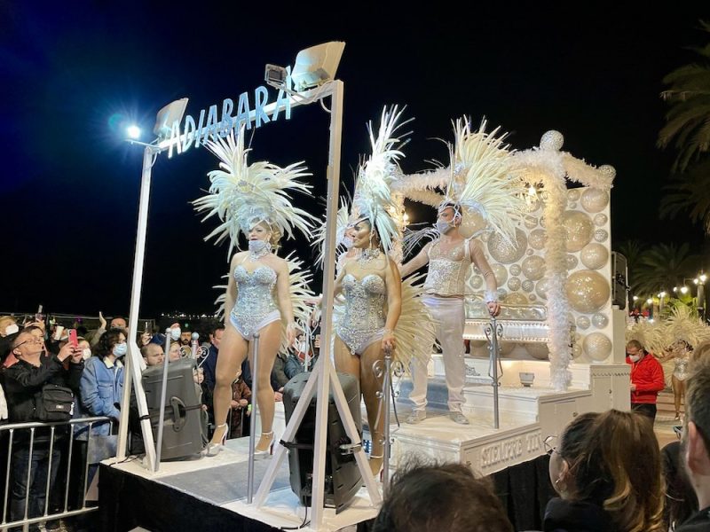 Dancers are celebrating carnival while dancing on a platform
